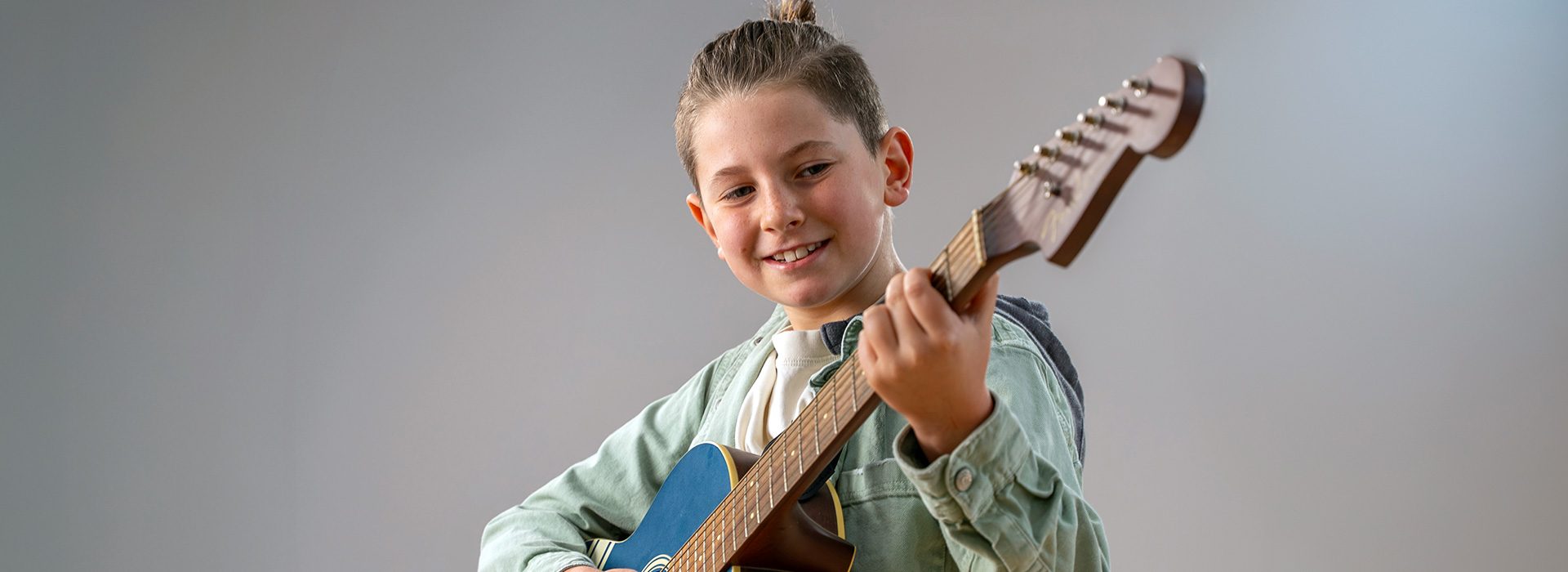 boy playing guitar