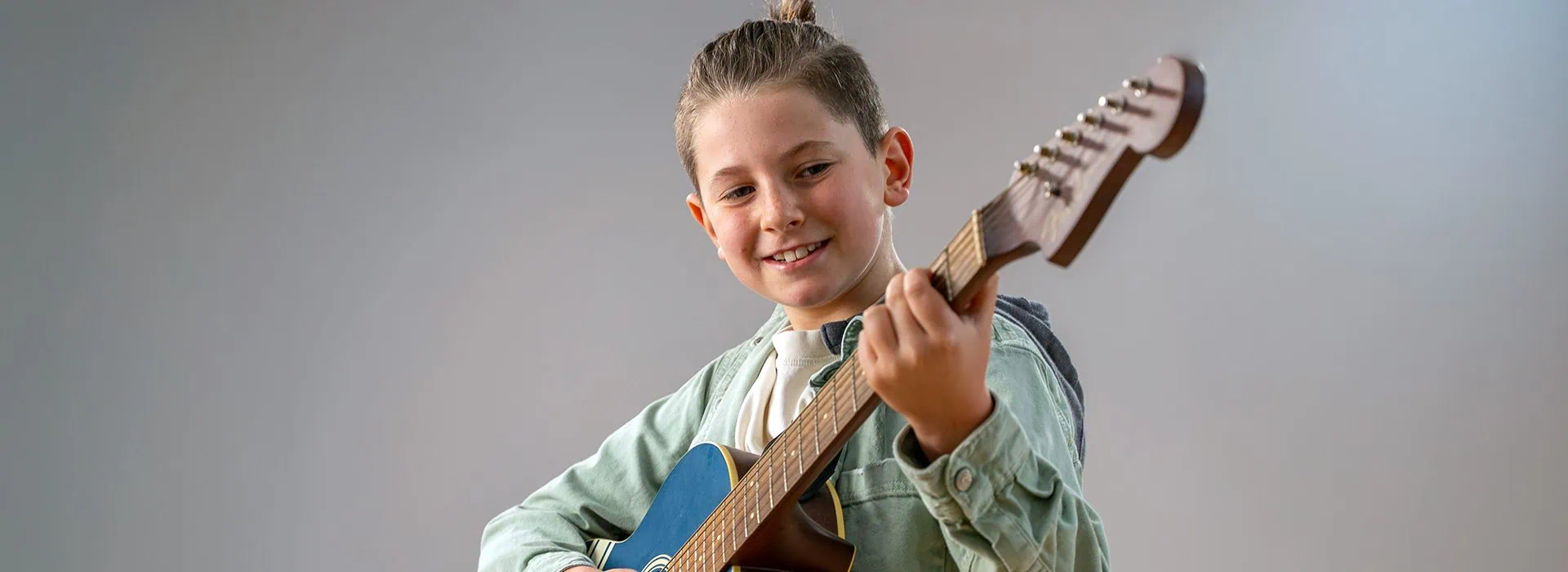 boy playing guitar