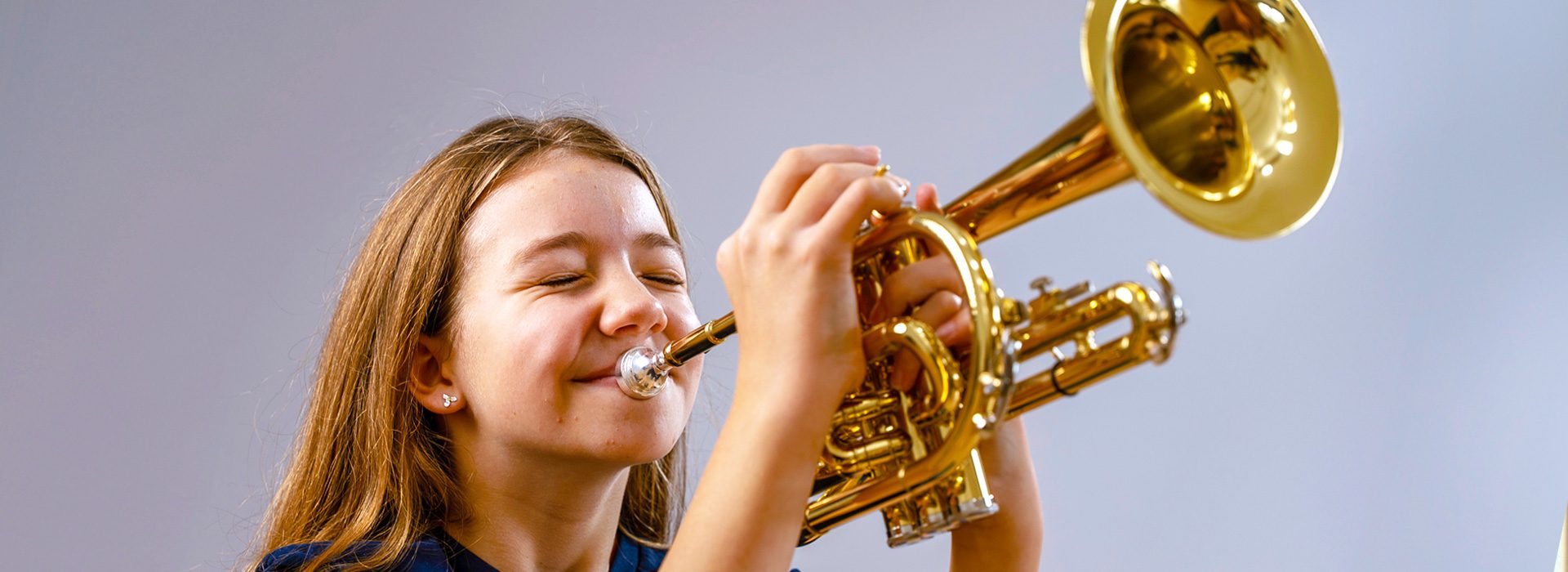 girl playing trumpet