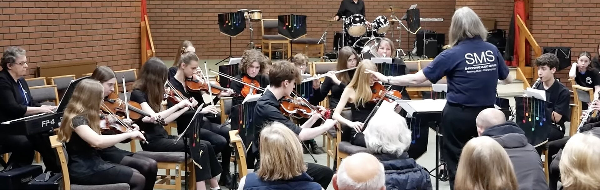 kids playing music in a group