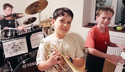 group of boys practicing playing music