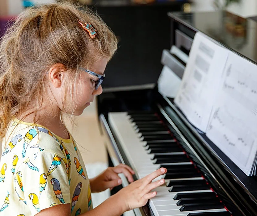 girl playing piano