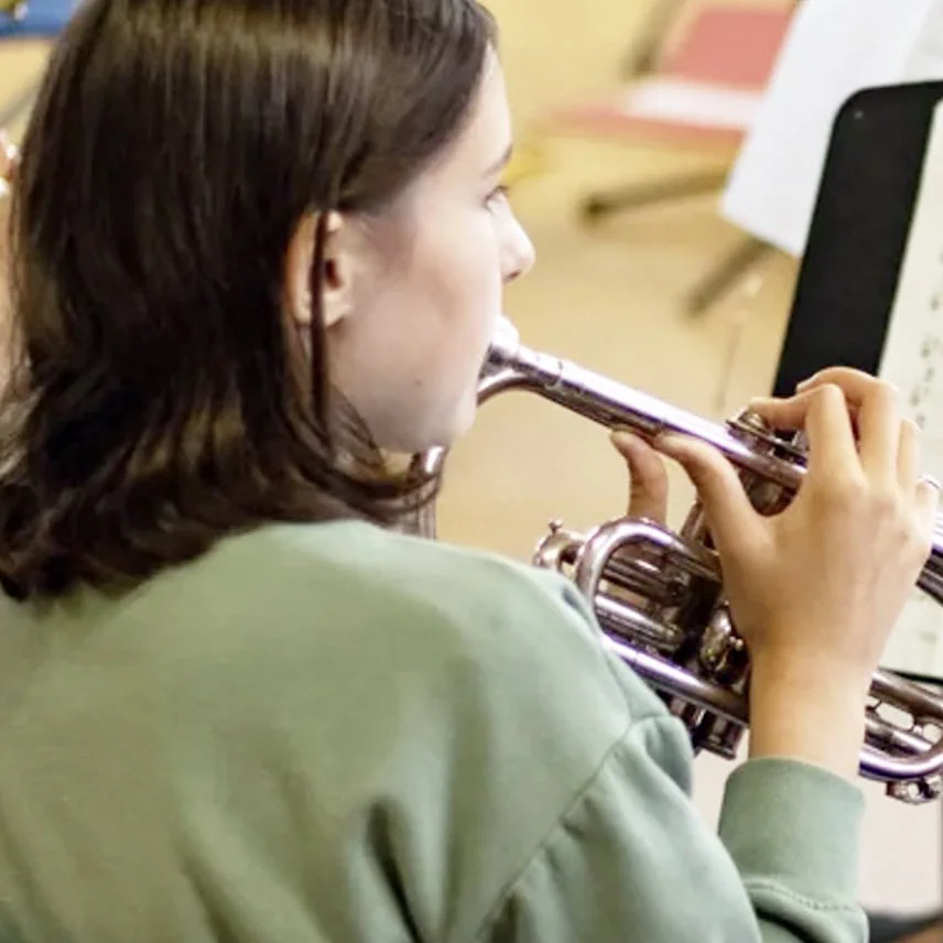 student playing a brass instrument