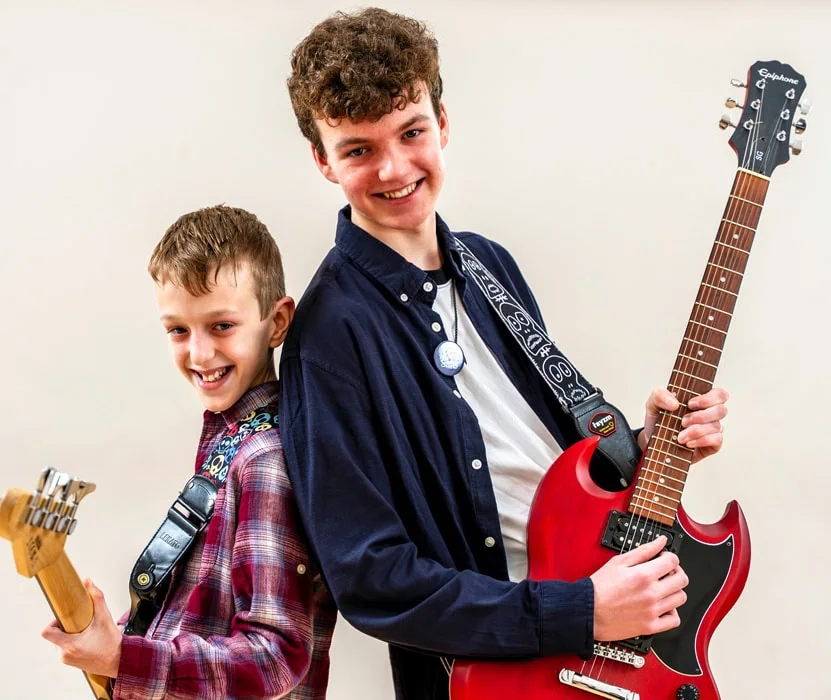 two boys with guitars